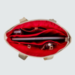 Umhängetasche aus Kunstleder mit versteckten Taschen und Trolleyband