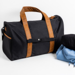 Tasche aus wasserabweisendem RPET mit Magnetverschluss und Fach