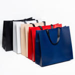 Premium Papiertüte matt mit Stoffgriffen und Seitenfalte