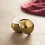 Lippenbalsam in einer ovalen Box Farbe gold Stimmungsbild