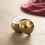 Lippenbalsam in einer ovalen Box Farbe gold Stimmungsbild mit Druck