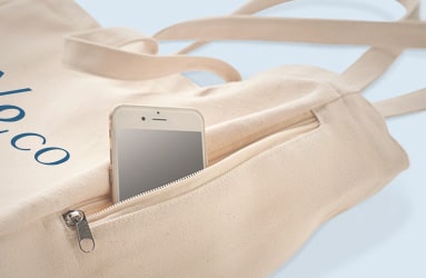 Cremefarbene Stofftasche mit Logo und praktischem Reißverschluss-Fach